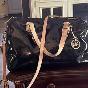 Michael Kors purse. Black, patent material. Size large, 13 x 8.5 x 8.5.